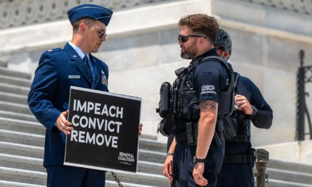 Air Force major who called for Trump's impeachment is locked in solitary confinement 24/7: Lawyer
